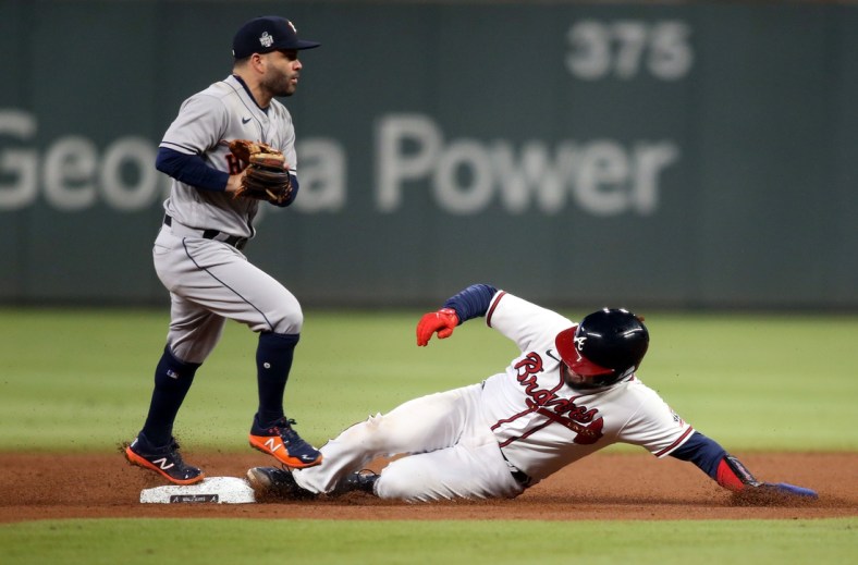 Oct 31, 2021; Atlanta, Georgia, USA; Houston Astros second baseman Jose Altuve (27) steps on second base for the out against Atlanta Braves catcher Travis d'Arnaud (16) during the fourth inning of game five of the 2021 World Series at Truist Park. Mandatory Credit: Brett Davis-USA TODAY Sports