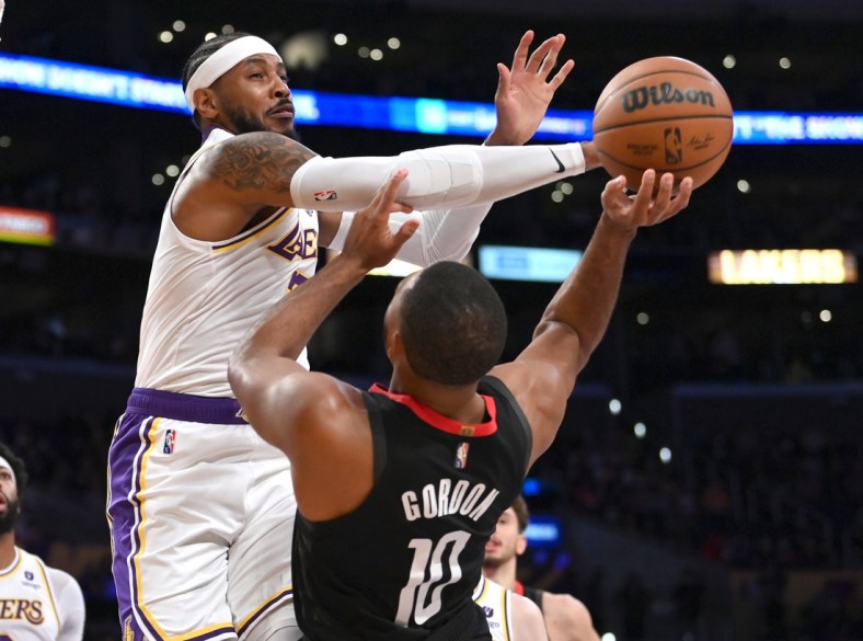 Oct 31, 2021; Los Angeles, California, USA;  Houston Rockets guard Eric Gordon (10) is fouled by Los Angeles Lakers forward Carmelo Anthony (7) in the first half at Staples Center. Mandatory Credit: Jayne Kamin-Oncea-USA TODAY Sports