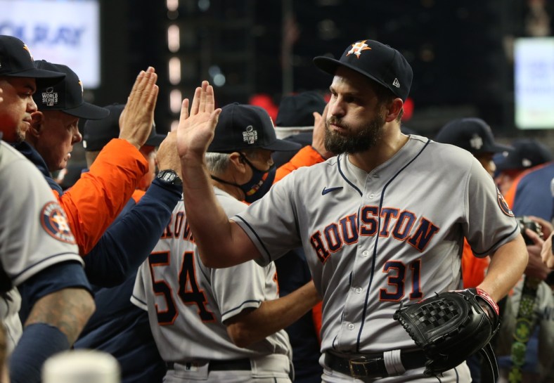 Oct 31, 2021; Atlanta, Georgia, USA; Houston Astros relief pitcher Kendall Graveman (31) celebrates with teammates after defeating the Atlanta Braves in game five of the 2021 World Series at Truist Park. Mandatory Credit: Brett Davis-USA TODAY Sports