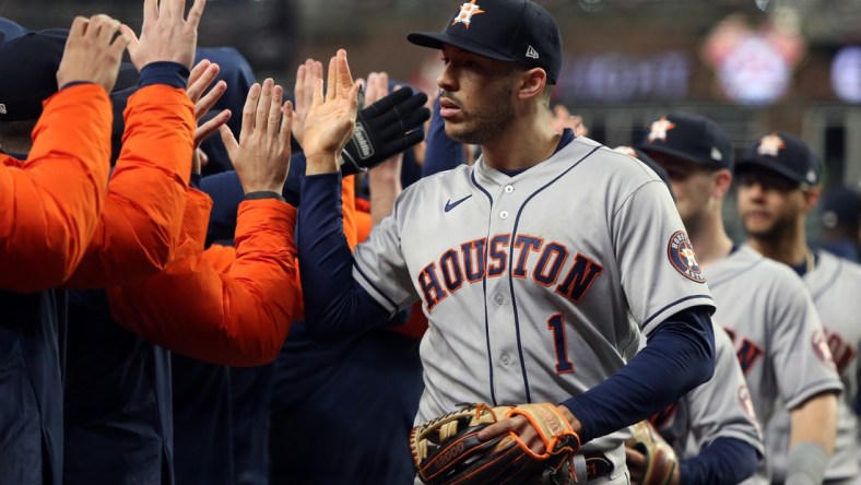 Oct 31, 2021; Atlanta, Georgia, USA; Houston Astros shortstop Carlos Correa (1) celebrates with teammates after defeating the Atlanta Braves in game five of the 2021 World Series at Truist Park. Mandatory Credit: Brett Davis-USA TODAY Sports