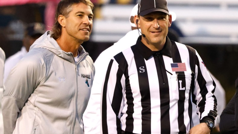 Oct 20, 2021; Boone, North Carolina, USA; Coastal Carolina Chanticleers head coach Jamey Chadwell (left) talks with an official before the game against the Appalachian State Mountaineers at Kidd Brewer Stadium. Mandatory Credit: Reinhold Matay-USA TODAY Sports