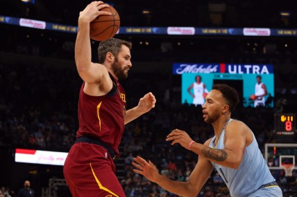 Oct 20, 2021; Memphis, Tennessee, USA; Cleveland Cavaliers forward Kevin Love (0) and Memphis Grizzles guard Kyle Anderson (1) defends during the first half at FedExForum. Mandatory Credit: Petre Thomas-USA TODAY Sports