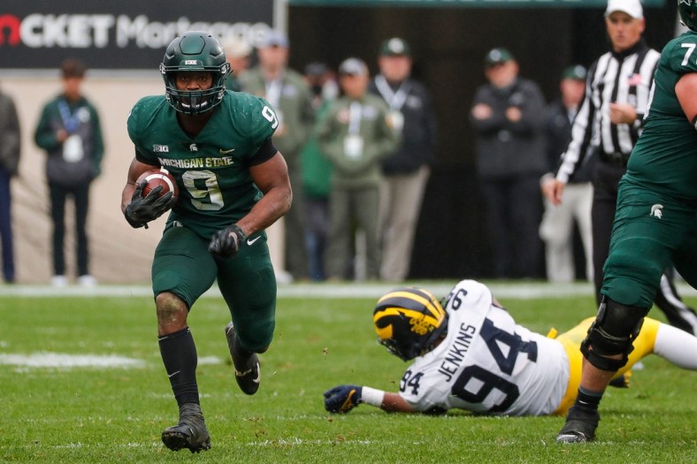 Michigan State running back Kenneth Walker III runs against Michigan during the second half at Spartan Stadium in East Lansing on Saturday, Oct. 30, 2021.