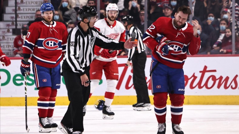 Nov 2, 2021; Montreal, Quebec, CAN; Montreal Canadiens left wing Jonathan Drouin (92) reacts after being hit by the puck during the first period against Detroit Red Wings at Bell Centre. Mandatory Credit: Jean-Yves Ahern-USA TODAY Sports