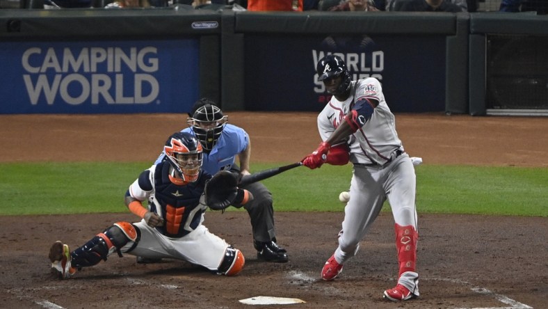 Nov 2, 2021; Houston, Texas, USA; Atlanta Braves designated hitter Jorge Soler (12) hits a three-run home run against the Houston Astros during the third inning of game six of the 2021 World Series at Minute Maid Park. Mandatory Credit: Jerome Miron-USA TODAY Sports