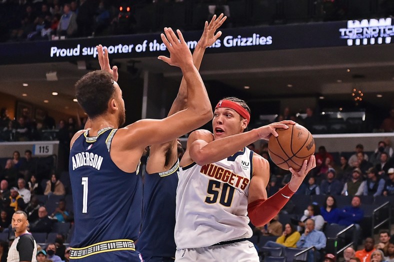 Nov 3, 2021; Memphis, Tennessee, USA; Denver Nuggets forward Aaron Gordon (50) handles the ball against Memphis Grizzlies forward Kyle Anderson (1) during the first half at FedExForum. Mandatory Credit: Justin Ford-USA TODAY Sports