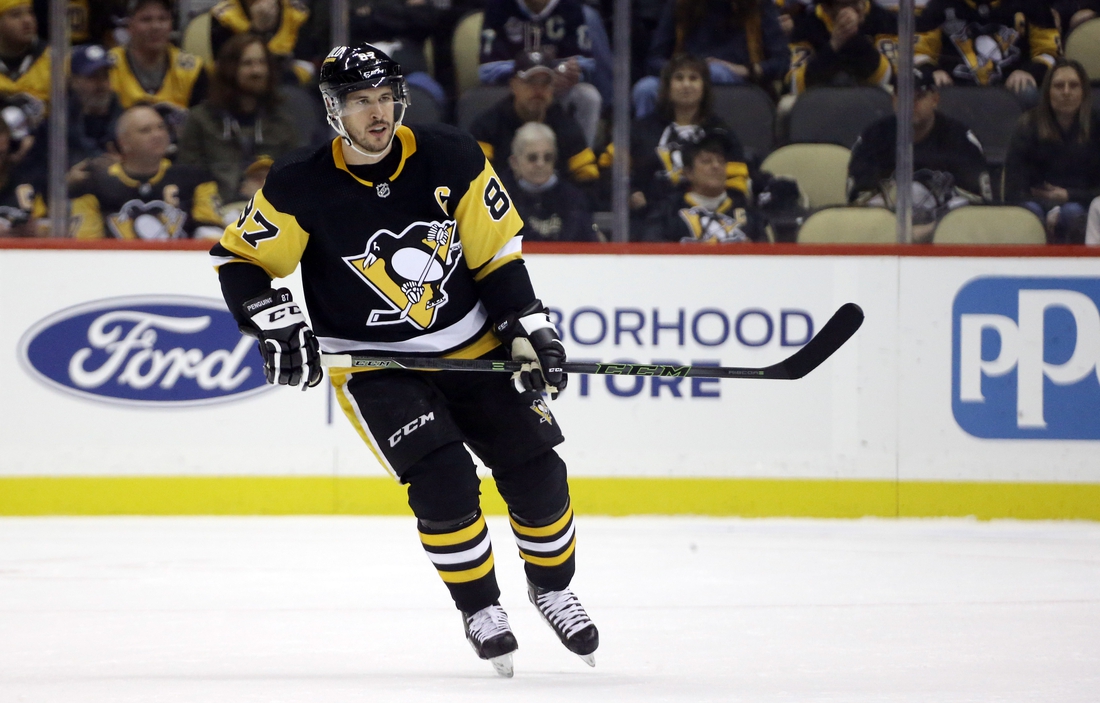 Oct 30, 2021; Pittsburgh, Pennsylvania, USA;  Pittsburgh Penguins center Sidney Crosby (87) skates against the New Jersey Devils during the first period at PPG Paints Arena. Mandatory Credit: Charles LeClaire-USA TODAY Sports