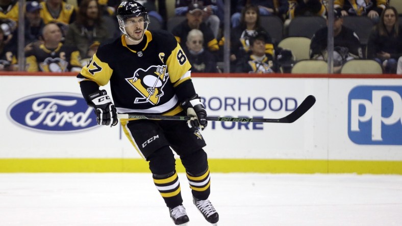 Oct 30, 2021; Pittsburgh, Pennsylvania, USA;  Pittsburgh Penguins center Sidney Crosby (87) skates against the New Jersey Devils during the first period at PPG Paints Arena. Mandatory Credit: Charles LeClaire-USA TODAY Sports