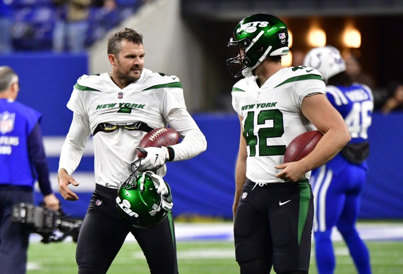 Nov 4, 2021; Indianapolis, Indiana, USA; New York Jets punter Thomas Morstead (left) talks with long snapper Thomas Hennessy (42) before the match against the Indianapolis Colts at Lucas Oil Stadium. Mandatory Credit: Marc Lebryk-USA TODAY Sports