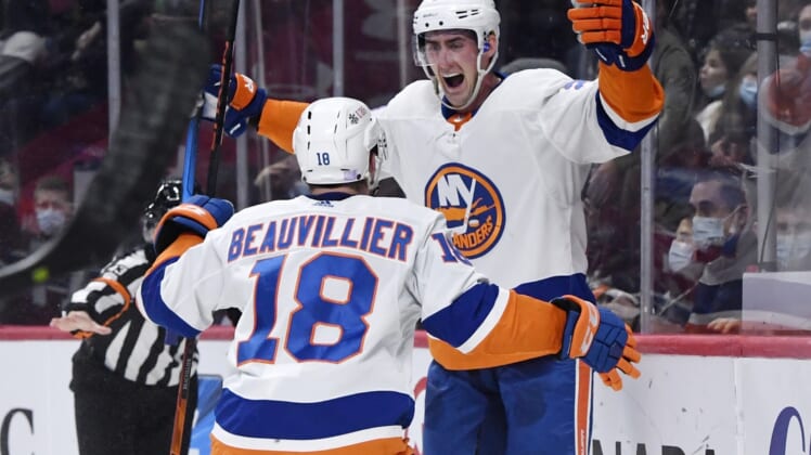 Nov 4, 2021; Montreal, Quebec, CAN; New York Islanders forward Brock Nelson (29) reacts with teammate forward Anthony Beauvillier (18) after scoring a goal against the Montreal Canadiens during the second period at the Bell Centre. Mandatory Credit: Eric Bolte-USA TODAY Sports