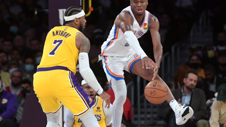 Nov 4, 2021; Los Angeles, California, USA; Los Angeles Lakers forward Carmelo Anthony (7) guards Oklahoma City Thunder guard Shai Gilgeous-Alexander (2) in the second half at Staples Center. Mandatory Credit: Jayne Kamin-Oncea-USA TODAY Sports