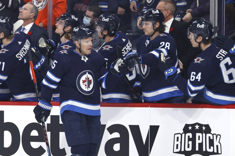Nov 5, 2021; Winnipeg, Manitoba, CAN;  Winnipeg Jets center Paul Stastny (25) celebrates his first period goal against the Chicago Blackhawks at Canada Life Centre. Mandatory Credit: James Carey Lauder-USA TODAY Sports