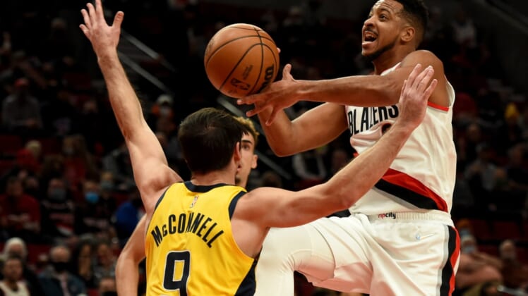 Nov 5, 2021; Portland, Oregon, USA; Portland Trail Blazers guard CJ McCollum (3) drives to the basket on Indiana Pacers guard T.J. McConnell (9) during the first quarter of the game at Moda Center. Mandatory Credit: Steve Dykes-USA TODAY Sports