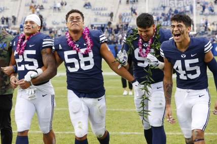 Nov 6, 2021; Provo, Utah, USA; Brigham Young Cougars running back Tyler Allgeier (25), defensive lineman Uriah Leiataua (58), defensive lineman Earl Tuioti-Mariner (91) wide receiver Samson Nacua (45) get together after their win over the Idaho State Bengals for senior day at LaVell Edwards Stadium. Mandatory Credit: Jeffrey Swinger-USA TODAY Sports