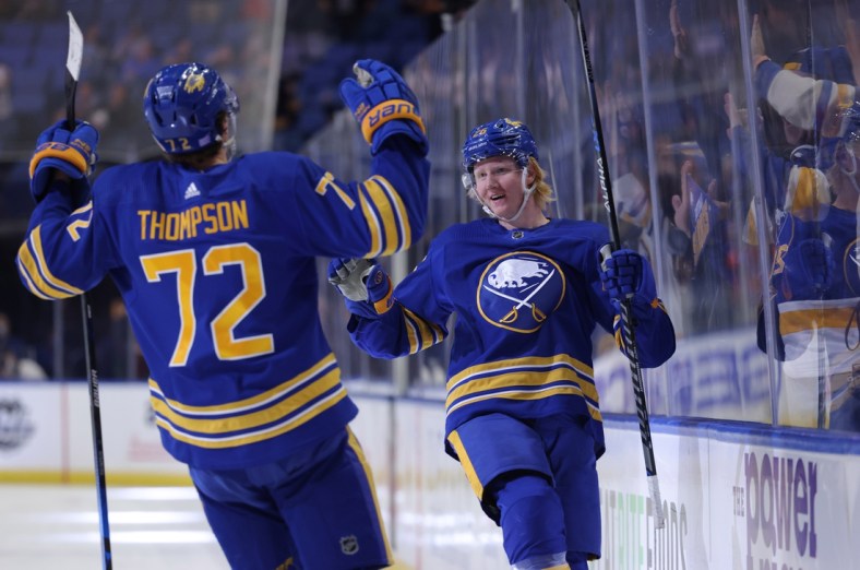 Nov 6, 2021; Buffalo, New York, USA;  Buffalo Sabres defenseman Rasmus Dahlin (26) celebrates his goal with right wing Tage Thompson (72) during the second period against the Detroit Red Wings at KeyBank Center. Mandatory Credit: Timothy T. Ludwig-USA TODAY Sports