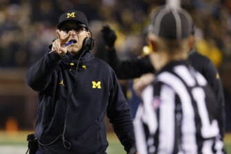Nov 6, 2021; Ann Arbor, Michigan, USA;  Michigan Wolverines head coach Jim Harbaugh singles they will go for a two point conversion in the second half against the Indiana Hoosiers at Michigan Stadium. Mandatory Credit: Rick Osentoski-USA TODAY Sports