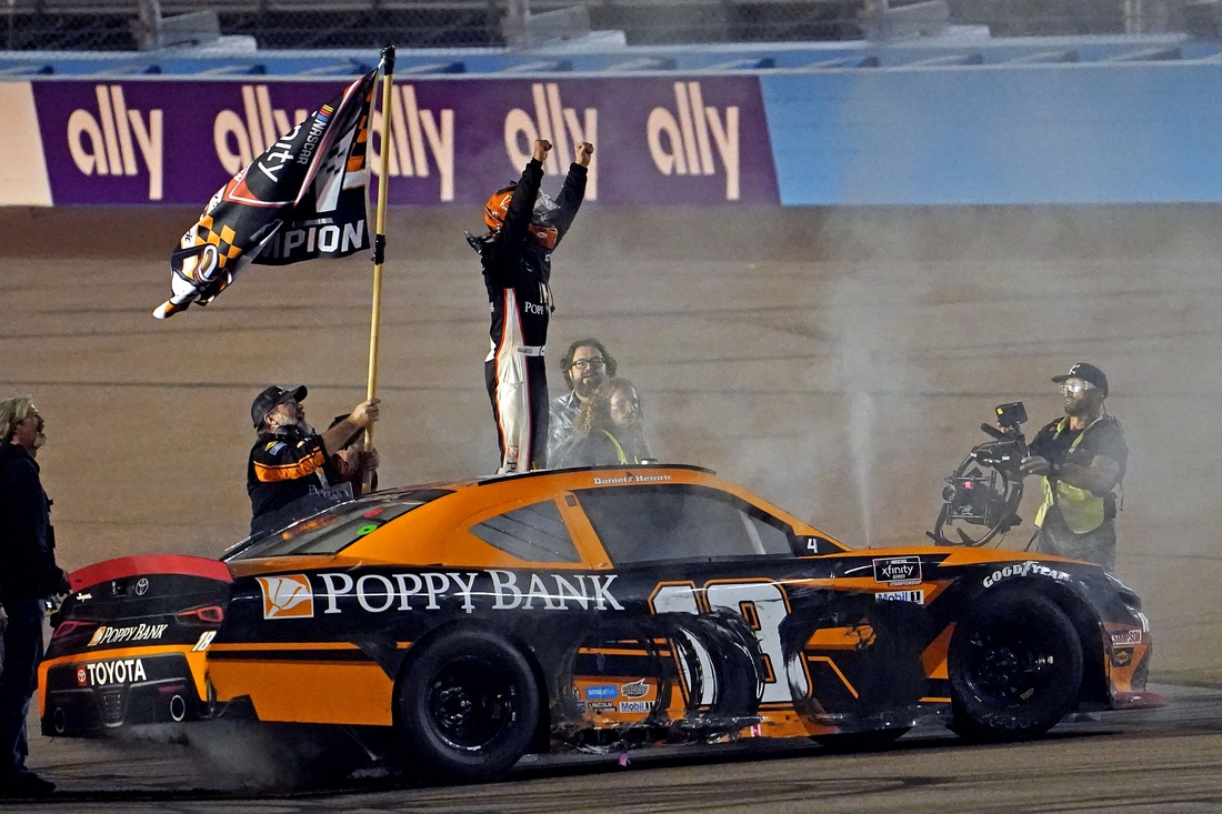 Nov 6, 2021; Phoenix, AZ, USA; Xfinity Series driver Daniel Hemric (18) celebrates winning the Xfinity Series Championship at Phoenix Raceway. Mandatory Credit: Peter Casey-USA TODAY Sports