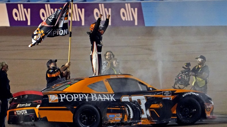 Nov 6, 2021; Phoenix, AZ, USA; Xfinity Series driver Daniel Hemric (18) celebrates winning the Xfinity Series Championship at Phoenix Raceway. Mandatory Credit: Peter Casey-USA TODAY Sports