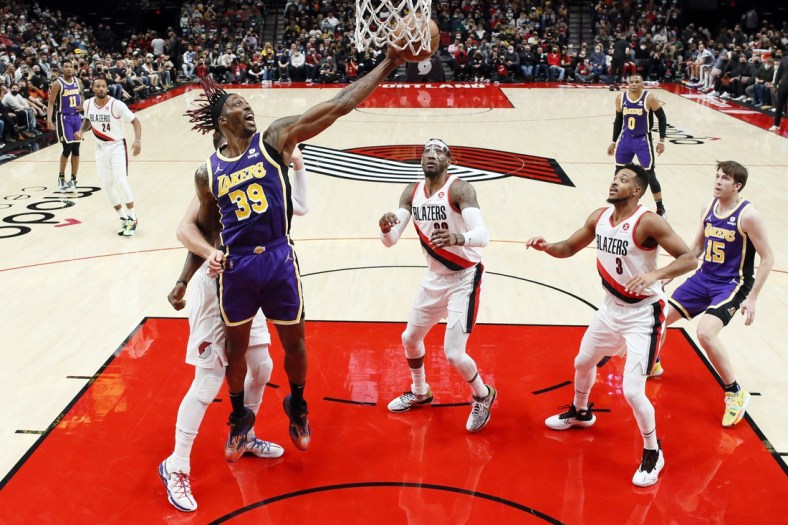 Nov 6, 2021; Portland, Oregon, USA; Los Angeles Lakers center Dwight Howard (39) grabs a rebound as Portland Trail Blazers center Jusuf Nurkic (27, left) defends during the first half at Moda Center. Mandatory Credit: Soobum Im-USA TODAY Sports