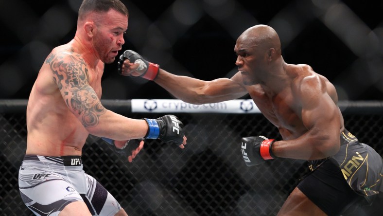 Nov 6, 2021; New York, NY, USA; Kamaru Usman (red gloves) competes against Colby Covington (blue gloves) during UFC 268 at Madison Square Garden. Mandatory Credit: Ed Mulholland-USA TODAY Sports