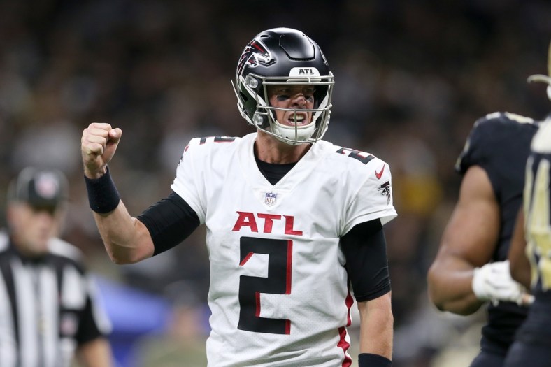 Nov 7, 2021; New Orleans, Louisiana, USA; Atlanta Falcons quarterback Matt Ryan (2) reacts after throwing a touchdown pass during the second quarter against the New Orleans Saints at the Caesars Superdome. Mandatory Credit: Chuck Cook-USA TODAY Sports