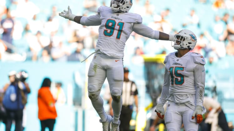 Nov 7, 2021; Miami Gardens, Florida, USA; Miami Dolphins defensive end Emmanuel Ogbah (91) reacts after sacking Houston Texans quarterback Tyrod Taylor (not pictured) during the second quarter of the game at Hard Rock Stadium. Mandatory Credit: Sam Navarro-USA TODAY Sports