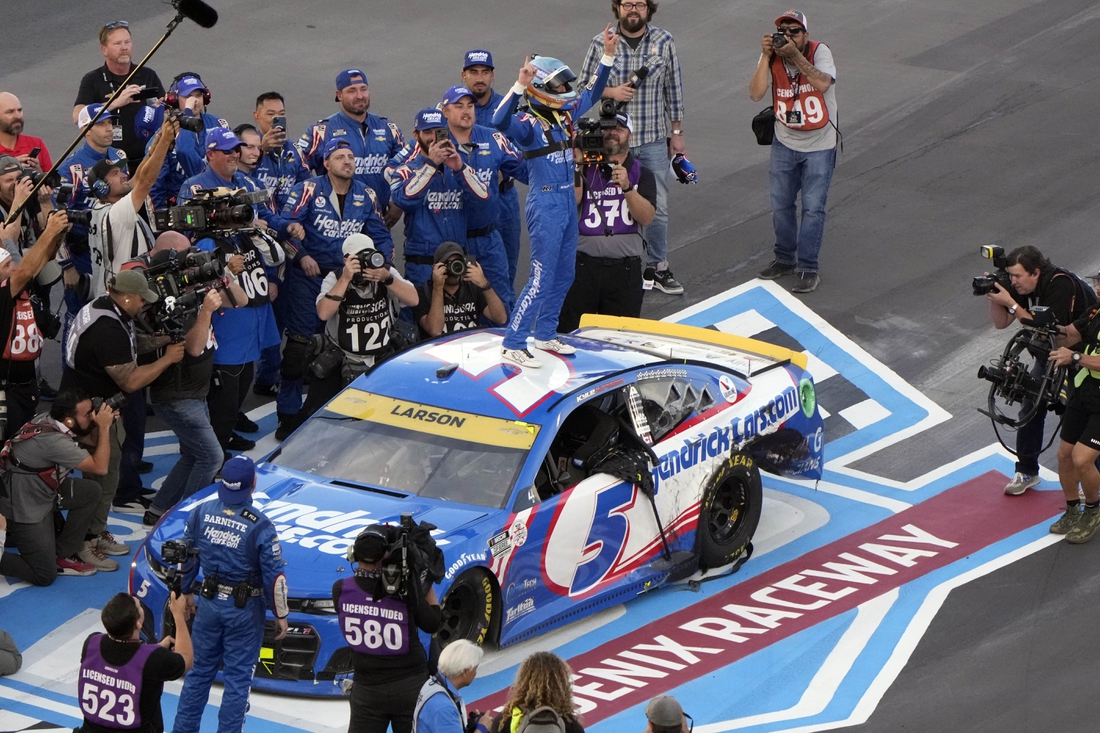 Nov 7, 2021; Avondale, Arizona, USA; NASCAR Cup Series driver Kyle Larson (5) celebrates winning the NASCAR Cup Series Championship at Phoenix Raceway. Mandatory Credit: Mike Dinovo-USA TODAY Sports