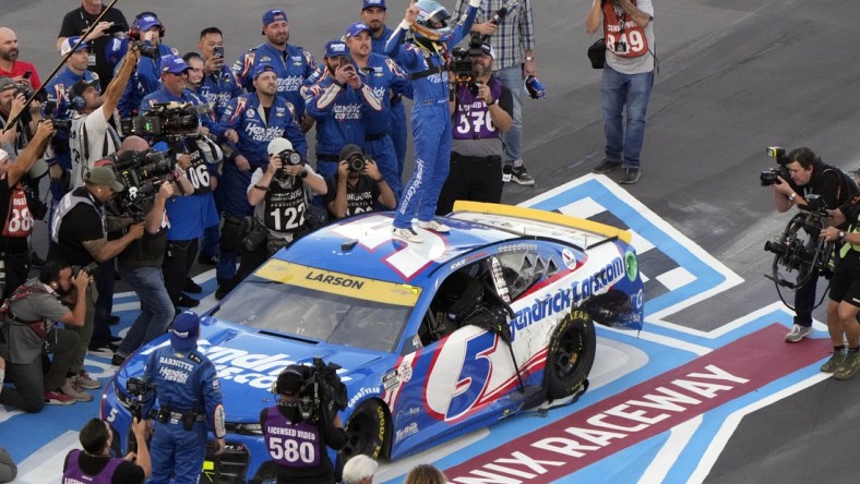 Nov 7, 2021; Avondale, Arizona, USA; NASCAR Cup Series driver Kyle Larson (5) celebrates winning the NASCAR Cup Series Championship at Phoenix Raceway. Mandatory Credit: Mike Dinovo-USA TODAY Sports