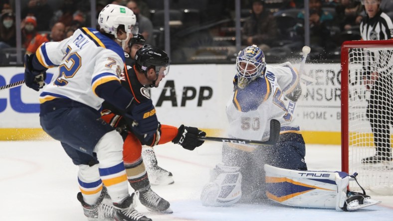 Nov 7, 2021; Anaheim, California, USA; Anaheim Ducks center Sam Carrick (39) scores a goal against St. Louis Blues goalie Jordan Binnington (50) during the second period at Honda Center. Mandatory Credit: Kiyoshi Mio-USA TODAY Sports