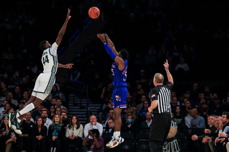 Nov 9, 2021; New York, New York, USA; Kansas Jayhawks guard Jalen Coleman-Lands (55) shoots the ball over Michigan State Spartans forward Gabe Brown (44) during the first half at Madison Square Garden. Mandatory Credit: Vincent Carchietta-USA TODAY Sports