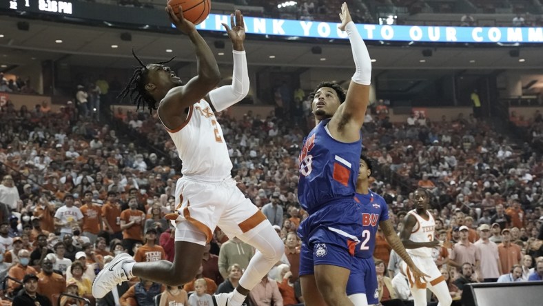 Nov 9, 2021; Austin, Texas, USA; Texas Longhorns guard Marcus Carr (2) shoots over Houston Baptist forward Sam Hofman (33) during the first quarter at Frank C. Erwin Jr. Center. Mandatory Credit: Scott Wachter-USA TODAY Sports