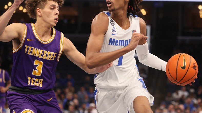 Memphis Tigers guard Emoni Bates drives past Tennessee Tech Golden Eagles guard Keishawn Davidson during their game at FedExForum on Tuesday, Nov. 9, 2021.

Jrca9418