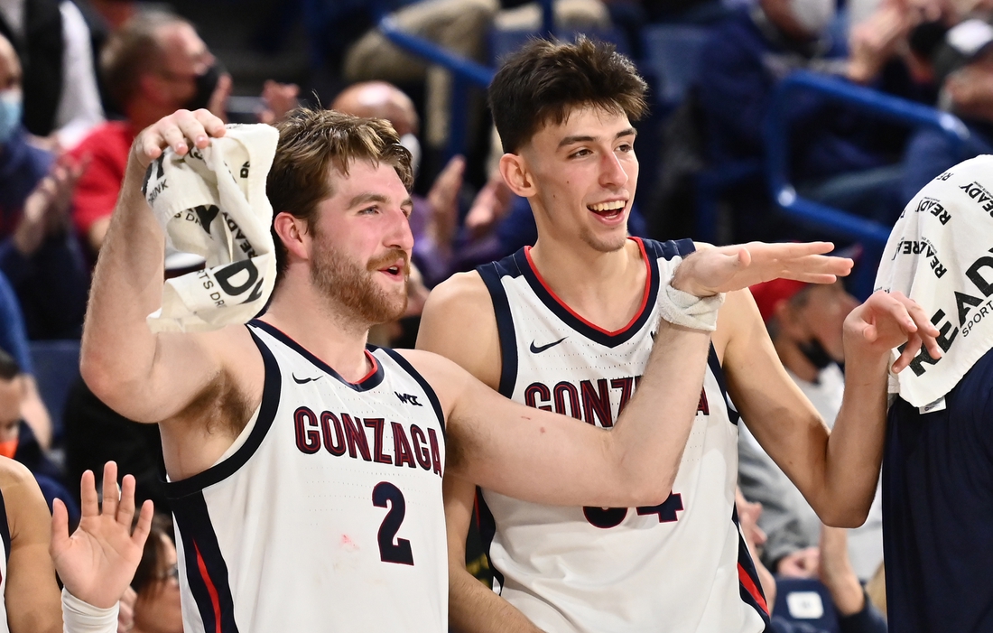 Gonzaga Bulldogs forward Drew Timme (2) and Gonzaga Bulldogs center Chet Holmgren (34) celebrate after a Gonzaga score against the Dixie State Trailblazers in the second half at McCarthey Athletic Center. The Bulldogs won 97-63. Mandatory Credit: James Snook-USA TODAY Sports