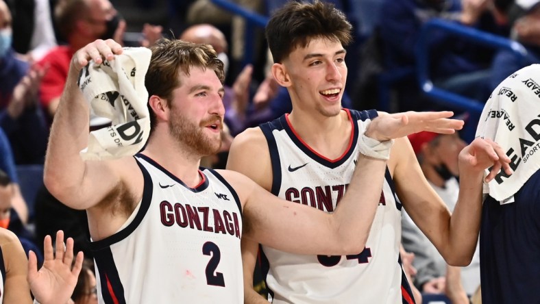 Gonzaga Bulldogs forward Drew Timme (2) and Gonzaga Bulldogs center Chet Holmgren (34) celebrate after a Gonzaga score against the Dixie State Trailblazers in the second half at McCarthey Athletic Center. The Bulldogs won 97-63. Mandatory Credit: James Snook-USA TODAY Sports