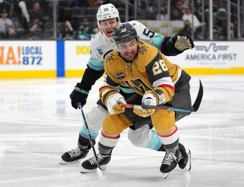 Nov 9, 2021; Las Vegas, Nevada, USA; Seattle Kraken defenseman Jeremy Lauzon (55) keeps pace with Vegas Golden Knights left wing William Carrier (28) during the second period at T-Mobile Arena. Mandatory Credit: Stephen R. Sylvanie-USA TODAY Sports