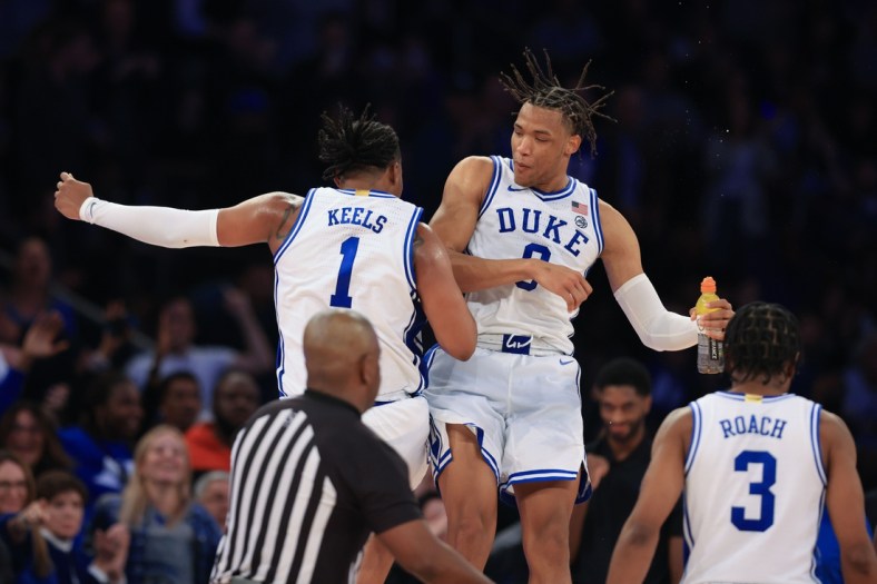 Nov 9, 2021; New York, New York, USA;Duke Blue Devils guard Trevor Keels (1) celebrates with forward Wendell Moore Jr. (0) during the second half against the Kentucky Wildcats at Madison Square Garden. Mandatory Credit: Vincent Carchietta-USA TODAY Sports
