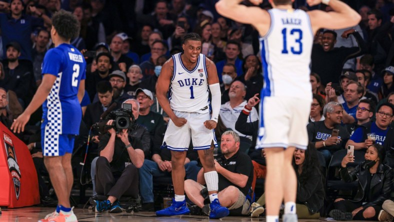 Nov 9, 2021; New York, New York, USA; Duke Blue Devils guard Trevor Keels (1) and forward Joey Baker (13) reacts behind Kentucky Wildcats guard Sahvir Wheeler (2) during the second half at Madison Square Garden. Mandatory Credit: Vincent Carchietta-USA TODAY Sports