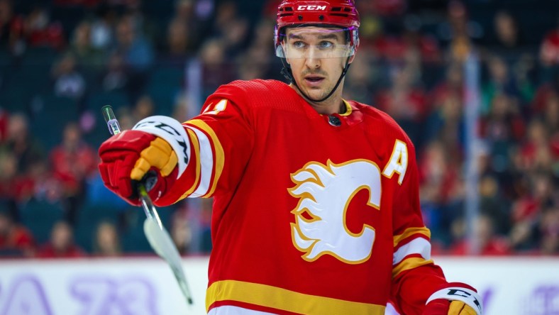 Nov 4, 2021; Calgary, Alberta, CAN; Calgary Flames center Mikael Backlund (11) against the Dallas Stars during the third period at Scotiabank Saddledome. Mandatory Credit: Sergei Belski-USA TODAY Sports