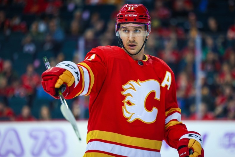 Nov 4, 2021; Calgary, Alberta, CAN; Calgary Flames center Mikael Backlund (11) against the Dallas Stars during the third period at Scotiabank Saddledome. Mandatory Credit: Sergei Belski-USA TODAY Sports