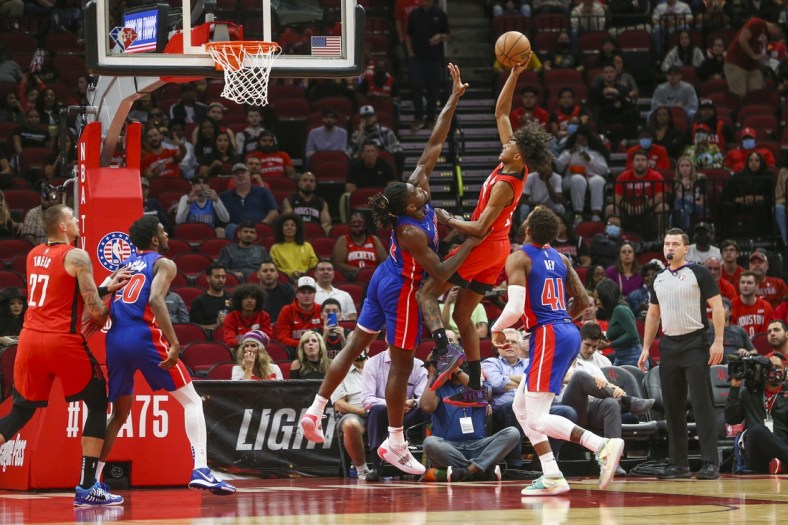 Nov 10, 2021; Houston, Texas, USA; Houston Rockets guard Jalen Green (0) shoots the ball over Detroit Pistons center Isaiah Stewart (28) in the first quarter at Toyota Center. Mandatory Credit: Thomas Shea-USA TODAY Sports