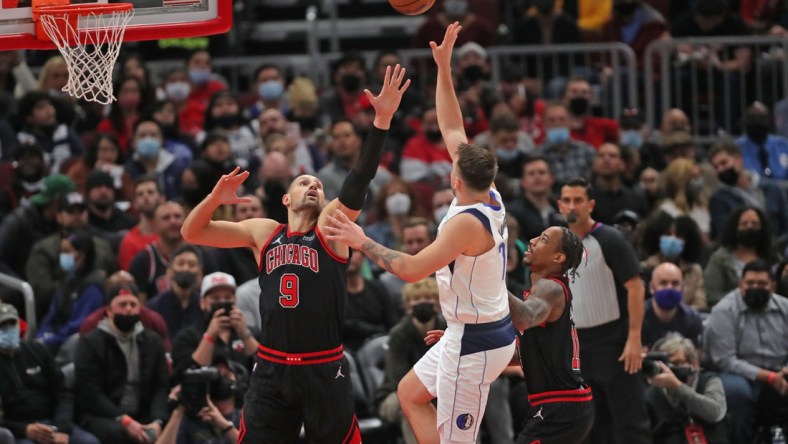 Nov 10, 2021; Chicago, Illinois, USA; Dallas Mavericks guard Luka Doncic (77) shoots over Chicago Bulls center Nikola Vucevic (9) during the first half at the United Center. Mandatory Credit: Dennis Wierzbicki-USA TODAY Sports