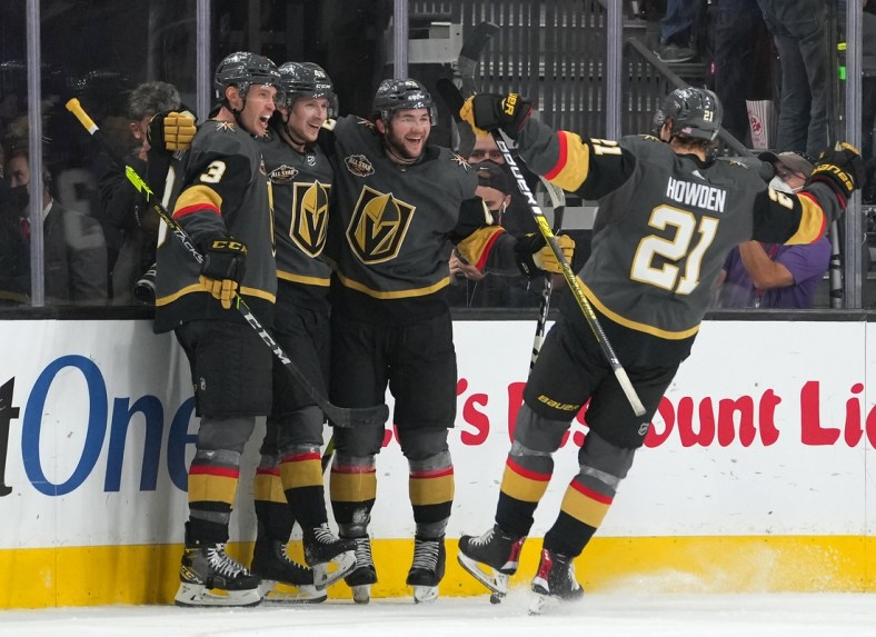 Nov 11, 2021; Las Vegas, Nevada, USA; Vegas Golden Knights players come together to celebrate a goal scored by Vegas Golden Knights right wing Jonas Rondbjerg (46) during the first period against the Minnesota Wild at T-Mobile Arena. Mandatory Credit: Stephen R. Sylvanie-USA TODAY Sports