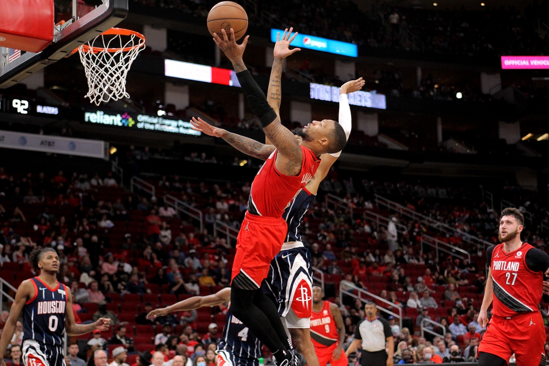 Nov 12, 2021; Houston, Texas, USA; Portland Trail Blazers guard Damian Lillard (0) drives for a layup attempt against the Houston Rockets during the fourth quarter at Toyota Center. Mandatory Credit: Erik Williams-USA TODAY Sports