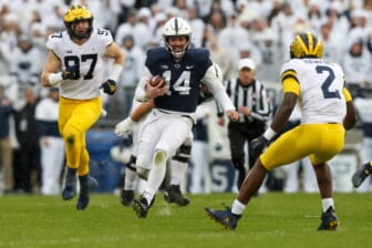 Nov 13, 2021; University Park, Pennsylvania, USA; Penn State Nittany Lions quarterback Sean Clifford (14) runs with the ball during the first quarter against the Michigan Wolverines at Beaver Stadium. Mandatory Credit: Matthew OHaren-USA TODAY Sports