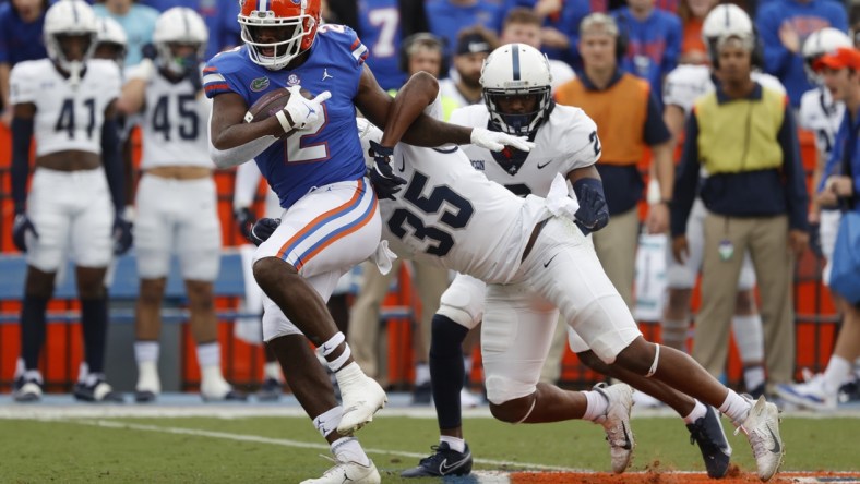 Nov 13, 2021; Gainesville, Florida, USA;Florida Gators tight end Kemore Gamble (2) runs past Samford Bulldogs defensive end Joseph Mera (35) during the first quarter at Ben Hill Griffin Stadium. Mandatory Credit: Kim Klement-USA TODAY Sports