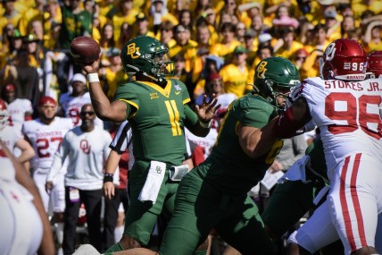Nov 13, 2021; Waco, Texas, USA; Baylor Bears quarterback Gerry Bohanon (11) passes for a touchdown against the Oklahoma Sooners during the first half at McLane Stadium. Mandatory Credit: Jerome Miron-USA TODAY Sports