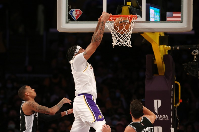 Nov 14, 2021; Los Angeles, California, USA;  Los Angeles Lakers forward Anthony Davis (3) dunks during the first half of the NBA game against San Antonio Spurs at Staples Center. Mandatory Credit: Kiyoshi Mio-USA TODAY Sports