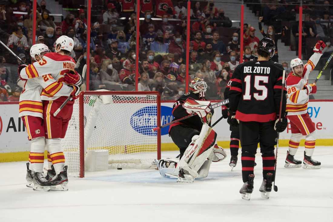 Nov 14, 2021; Ottawa, Ontario, CAN; The Calgary Flames celebrate a goal scored by left wing Andrew Mangiapane (88) against Ottawa Senators goalie Anton Forsberg (31) in the first period at the Canadian Tire Centre. Mandatory Credit: Marc DesRosiers-USA TODAY Sports