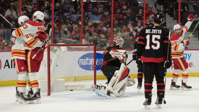 Nov 14, 2021; Ottawa, Ontario, CAN; The Calgary Flames celebrate a goal scored by left wing Andrew Mangiapane (88) against Ottawa Senators goalie Anton Forsberg (31) in the first period at the Canadian Tire Centre. Mandatory Credit: Marc DesRosiers-USA TODAY Sports