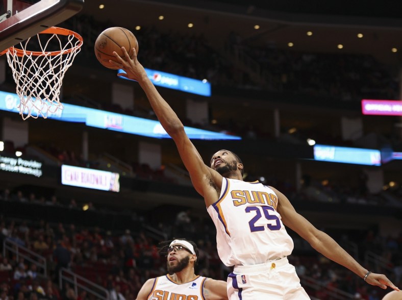 Nov 14, 2021; Houston, Texas, USA; Phoenix Suns forward Mikal Bridges (25) shoots the ball during the second quarter against the Houston Rockets at Toyota Center. Mandatory Credit: Troy Taormina-USA TODAY Sports